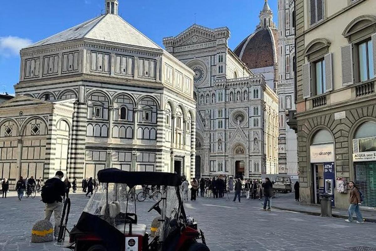 a city street with a cart in front of a building