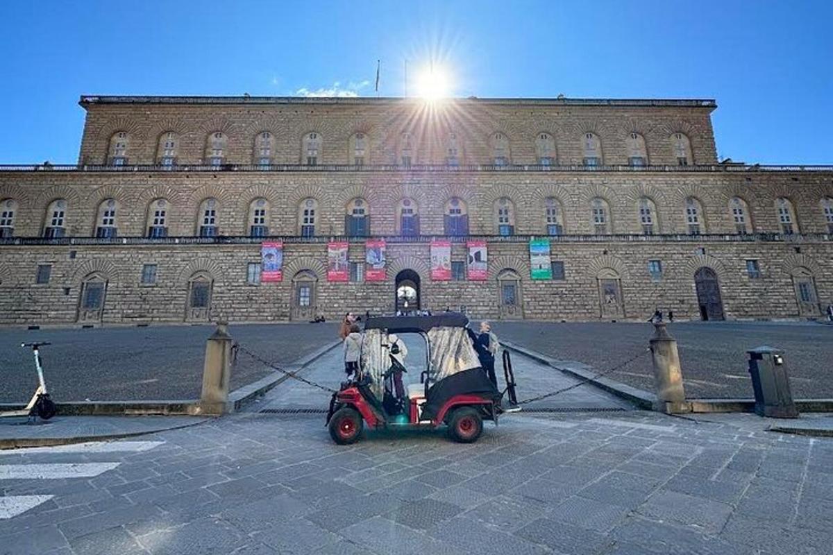 a small car parked in front of a building