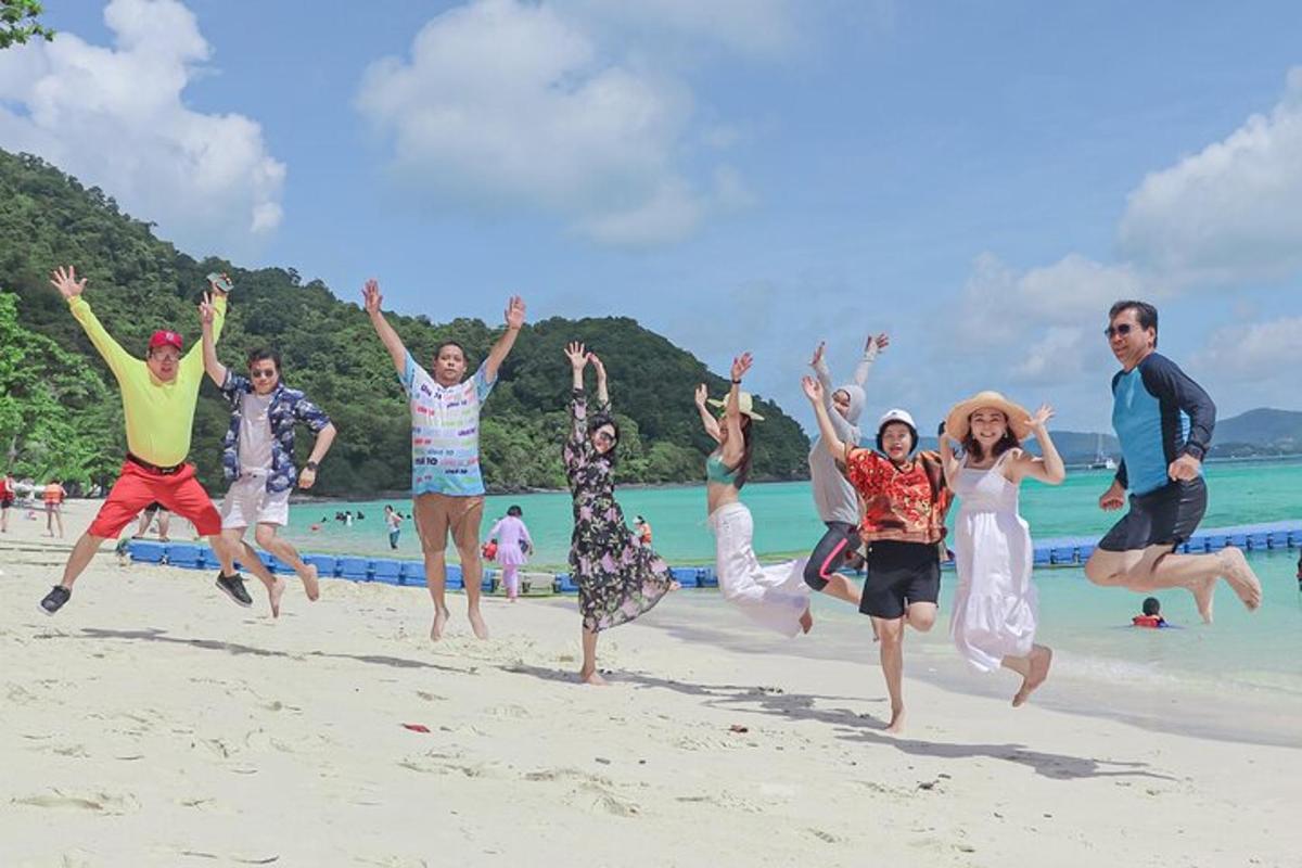 a group of people jumping on the beach