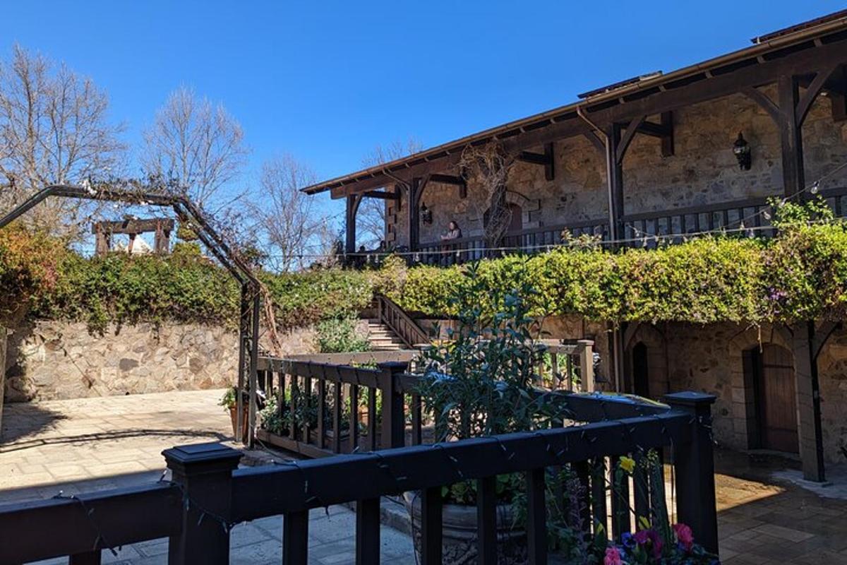 a building with a wooden fence and a building with stairs