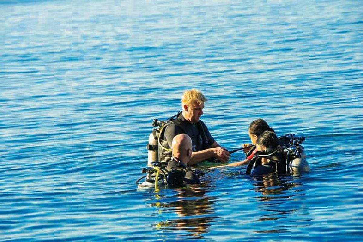 a man in the water with a dog in the water