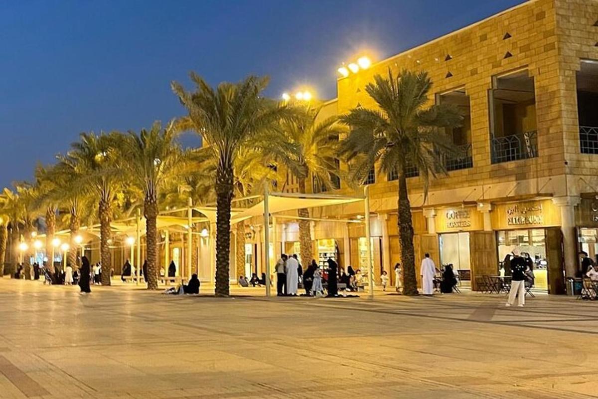 a group of palm trees in front of a building