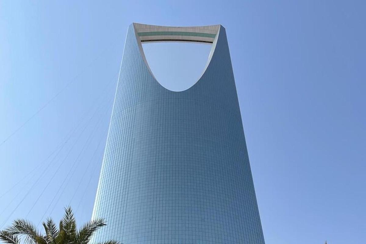 a tall building with a blue sky in the background