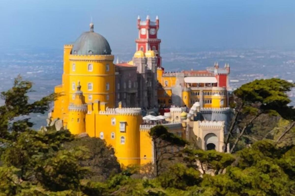 a yellow castle on top of a mountain