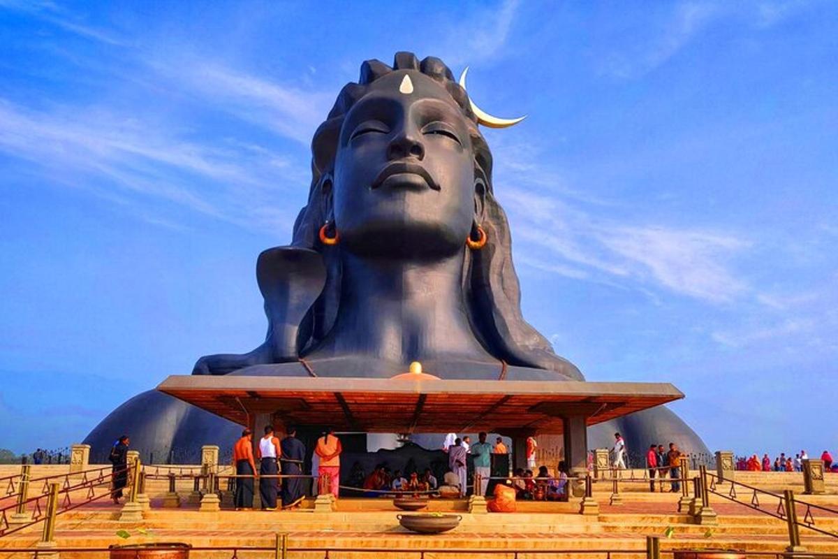 a large statue of a woman sitting in front
