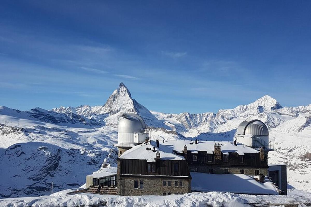 an observatory on top of a mountain in the snow