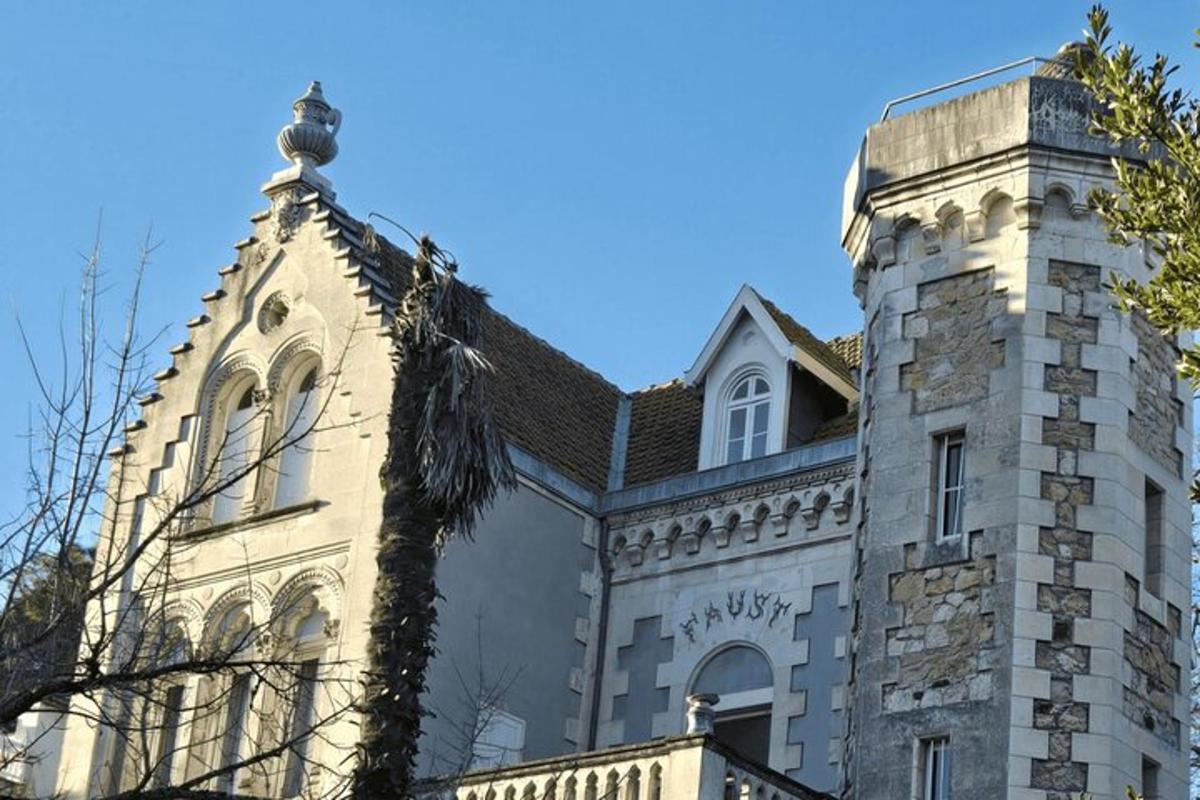 a building with a chimney and a turret
