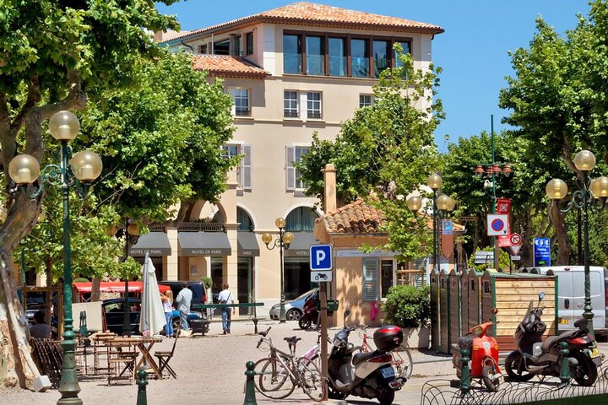 a street with motorcycles parked in front of a building