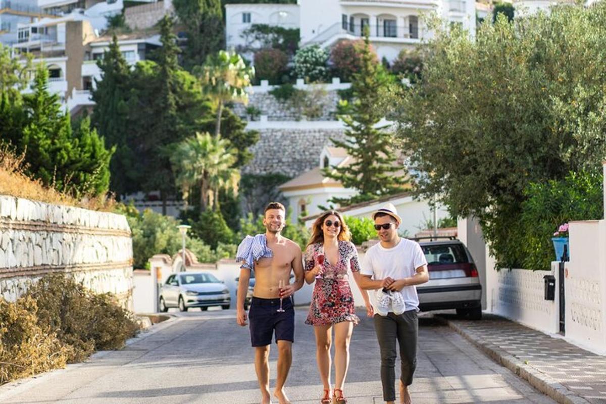 a group of three people walking down a street