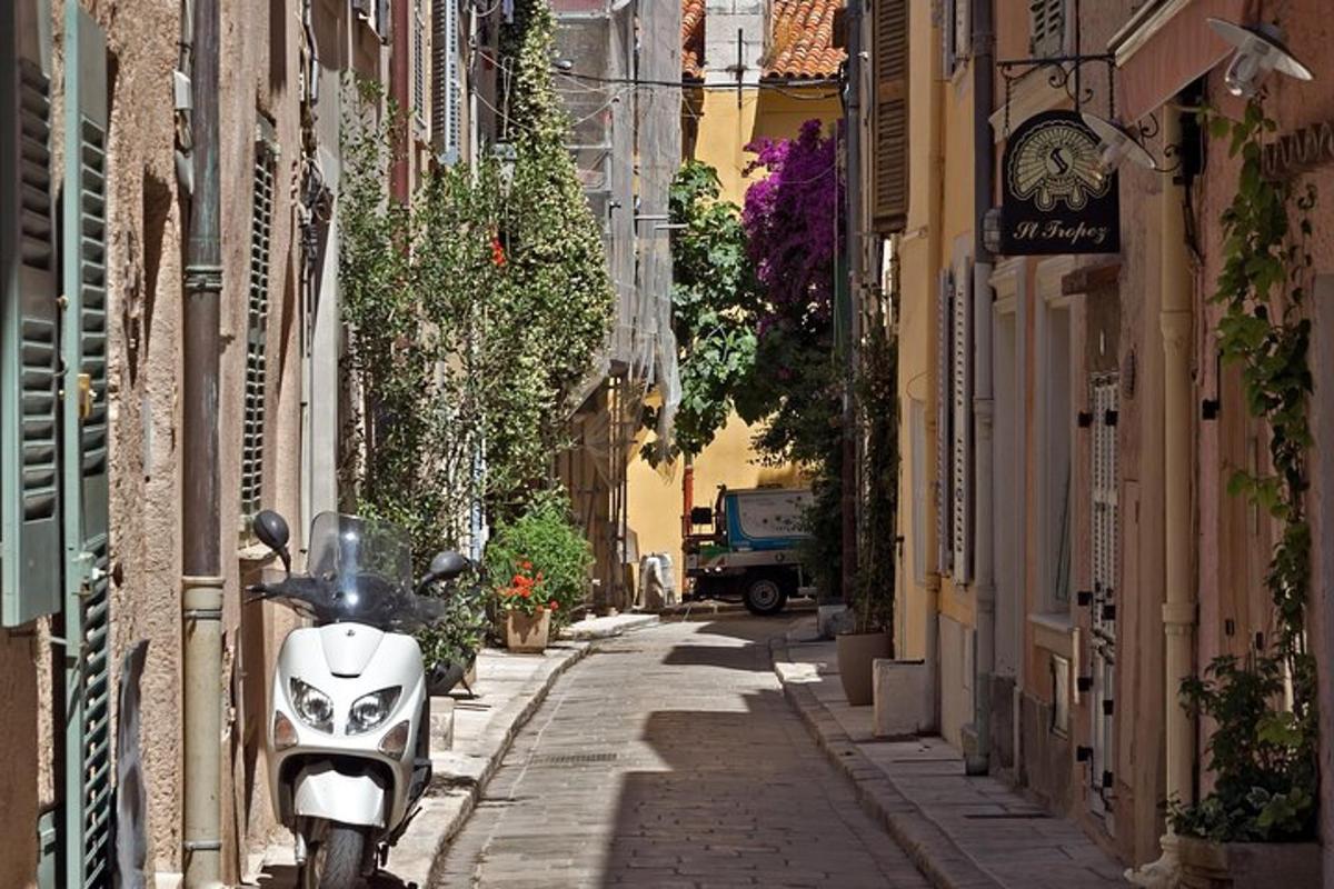a motorcycle parked on a street in an alley