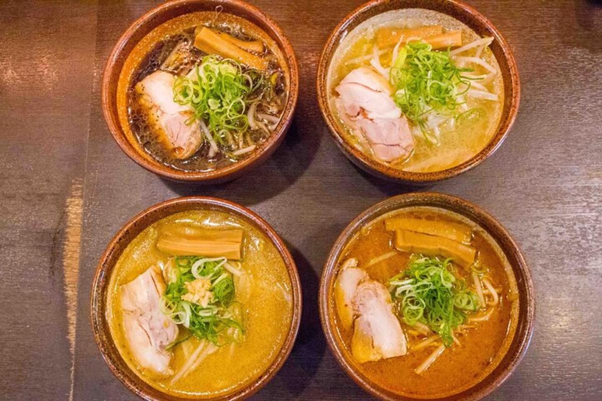 four bowls of different types of food on a table