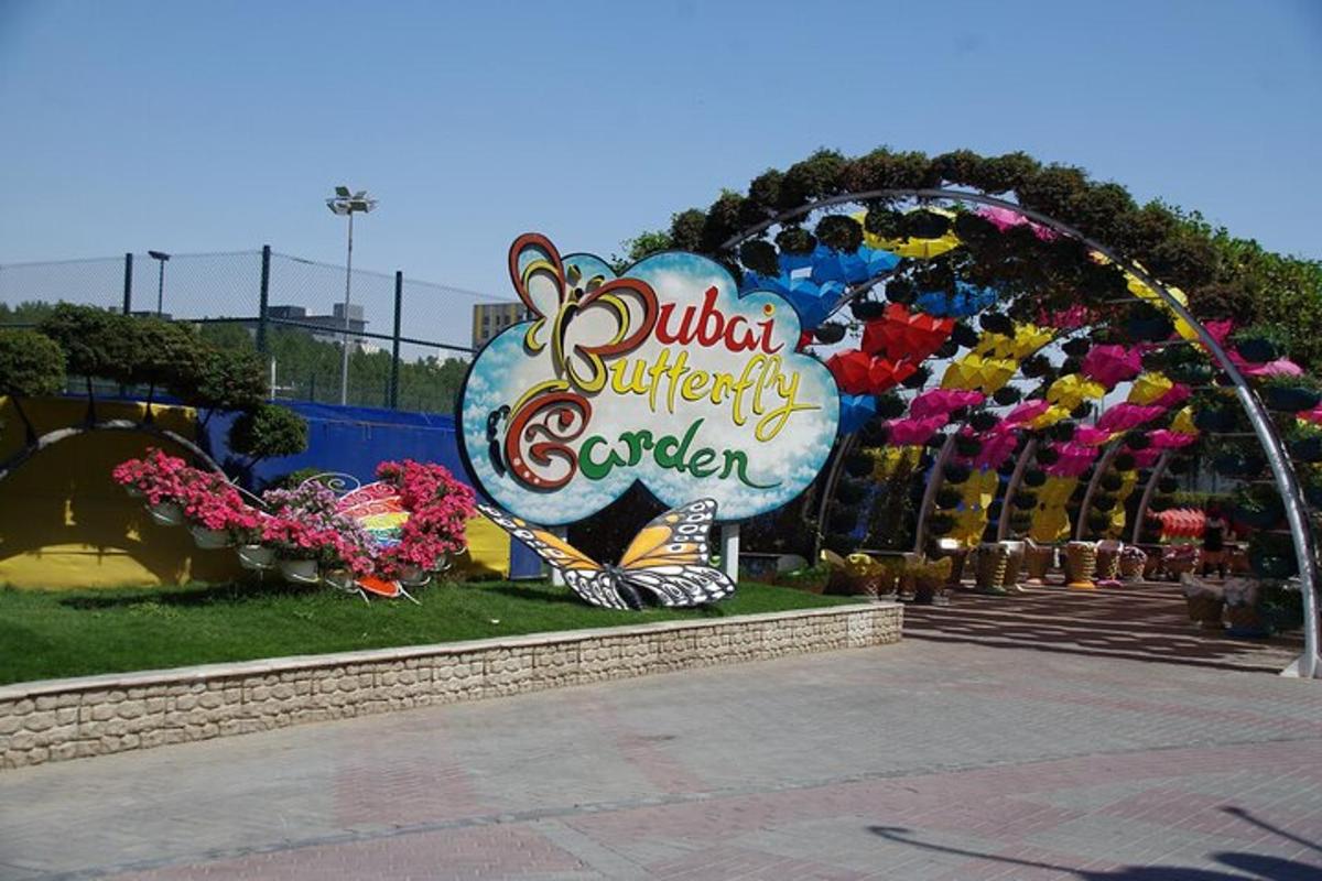 a sign for a flower garden at a theme park
