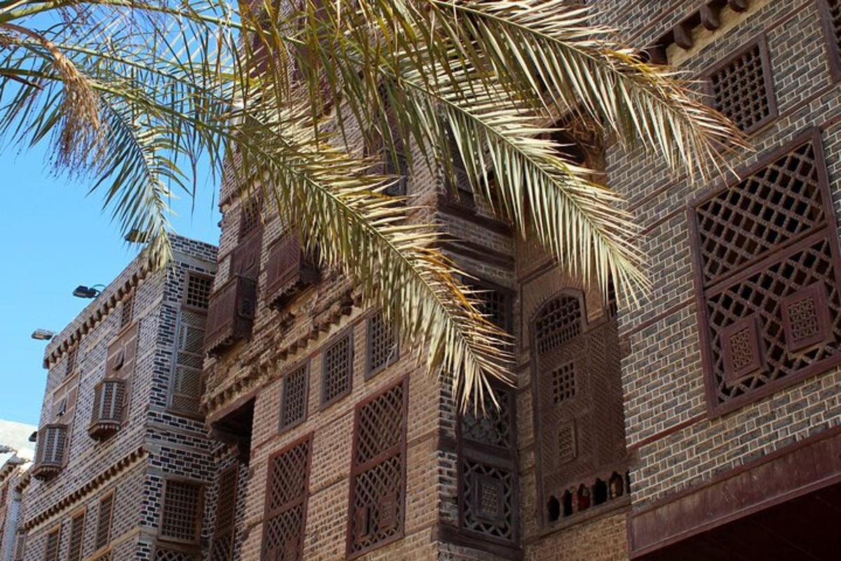 a building with a palm tree in front of it