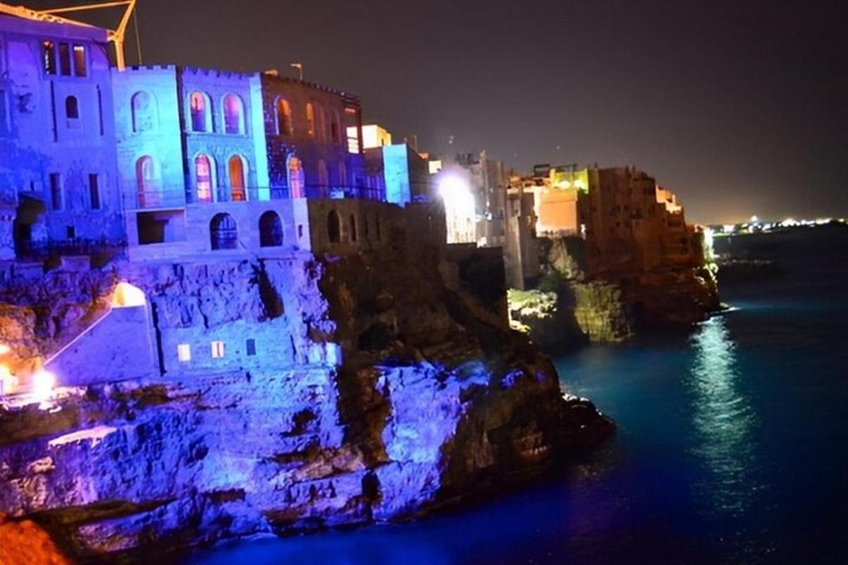 a building lit up in blue and white at night