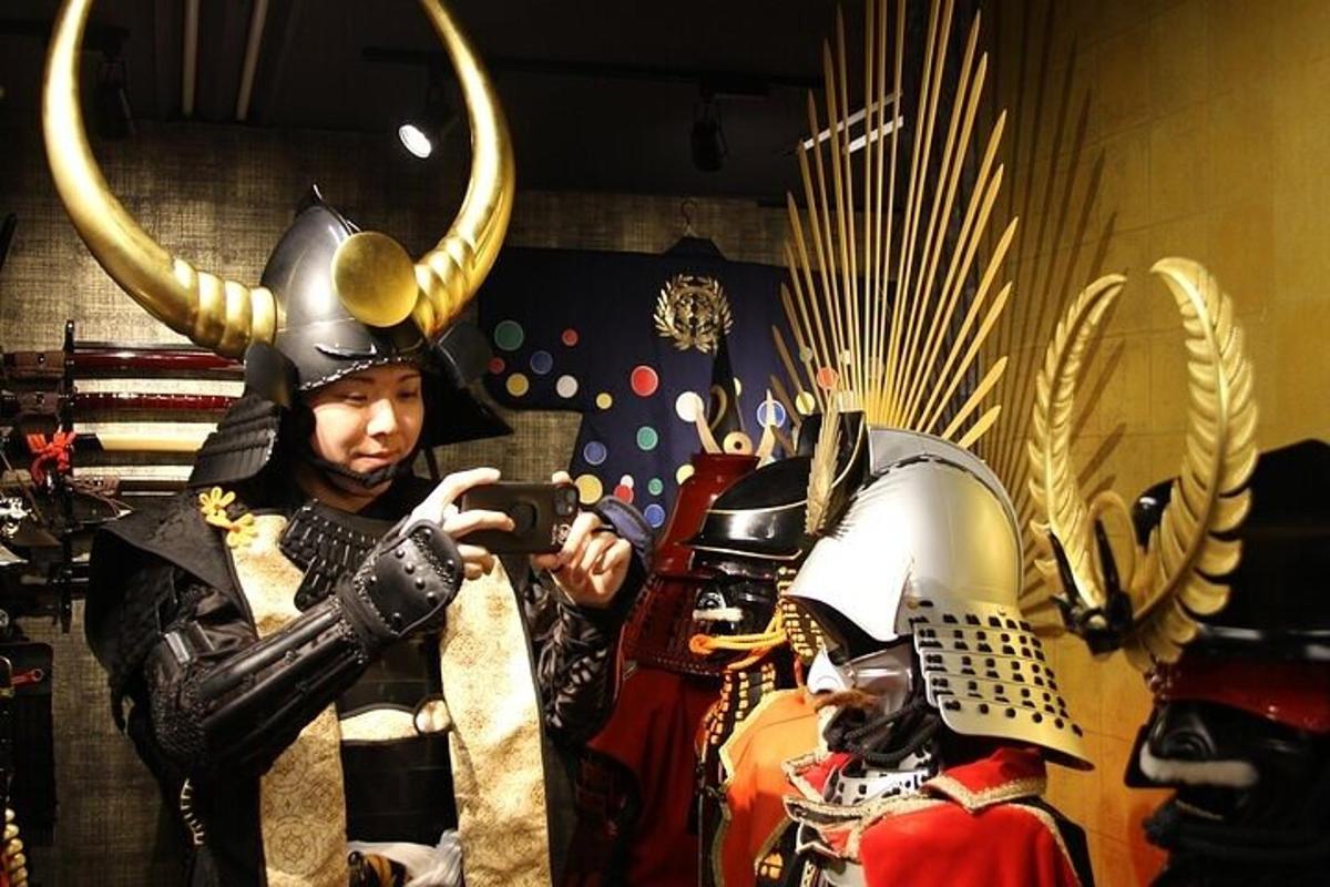 a man is taking a picture of a man in armour