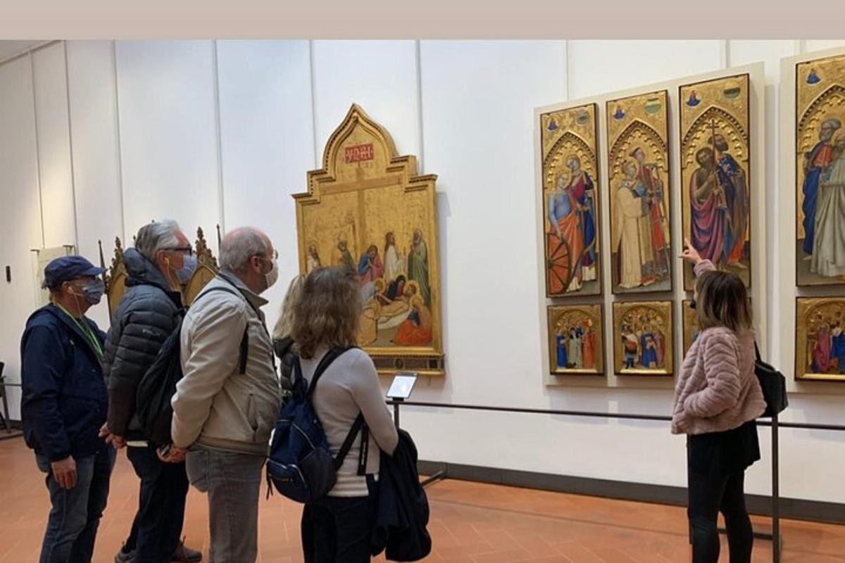a group of people looking at art in a museum