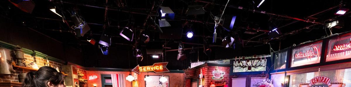 a room with a bunch of signs hanging from the ceiling