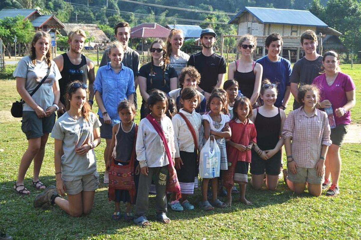 a group of people and children posing for a picture