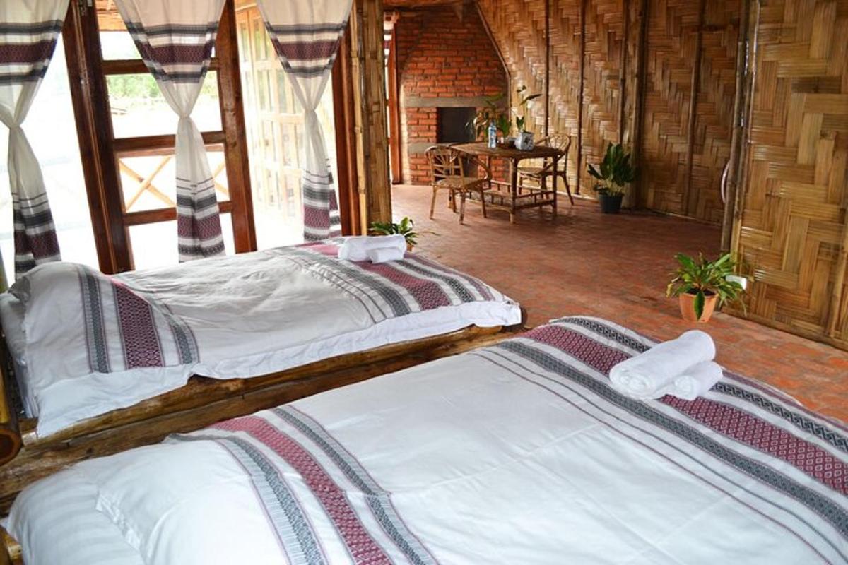 two twin beds in a room with a table