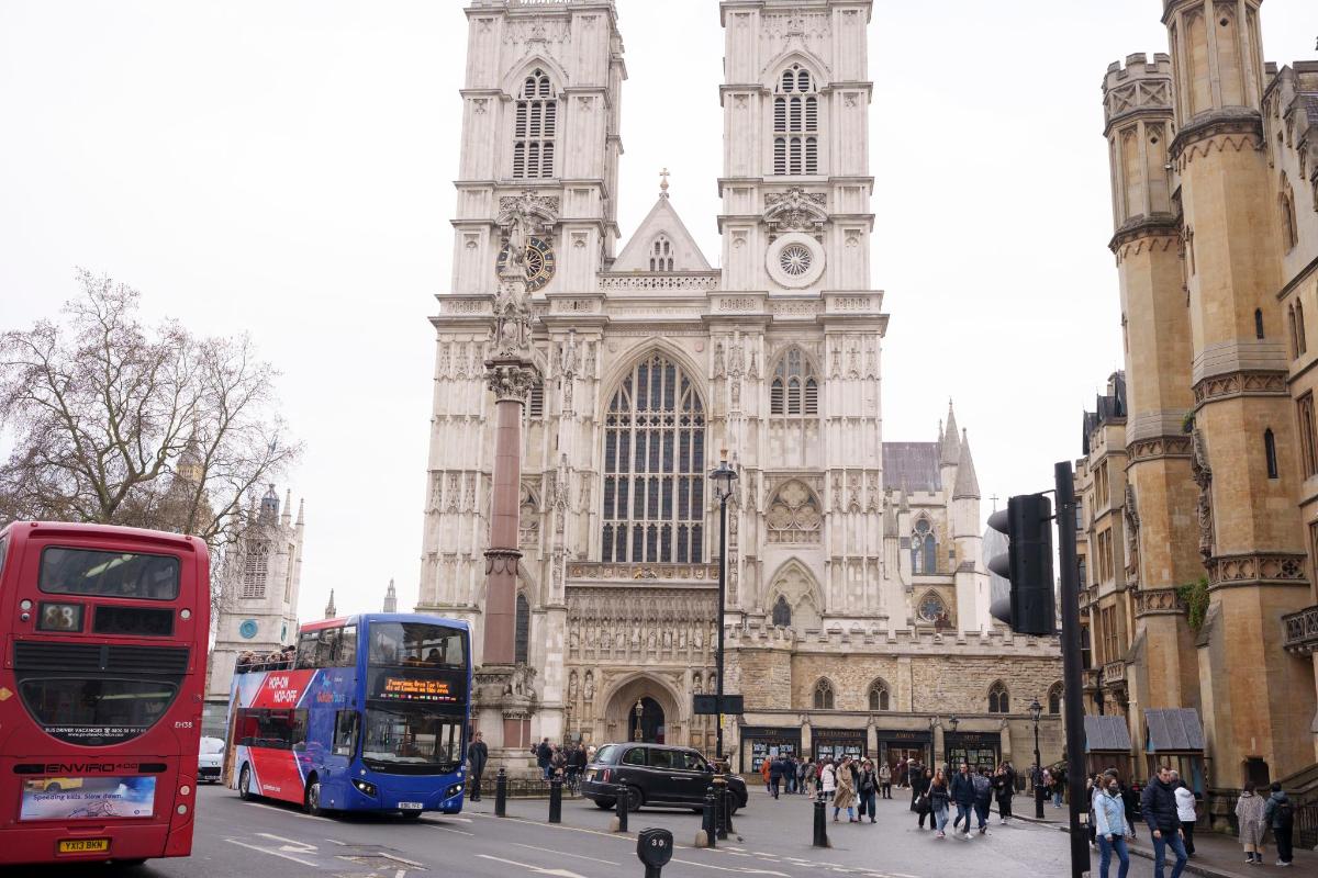 a cathedral with a double decker bus in front of it