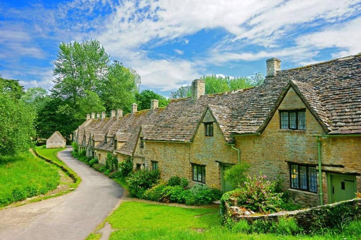 a row of old brick houses with a road