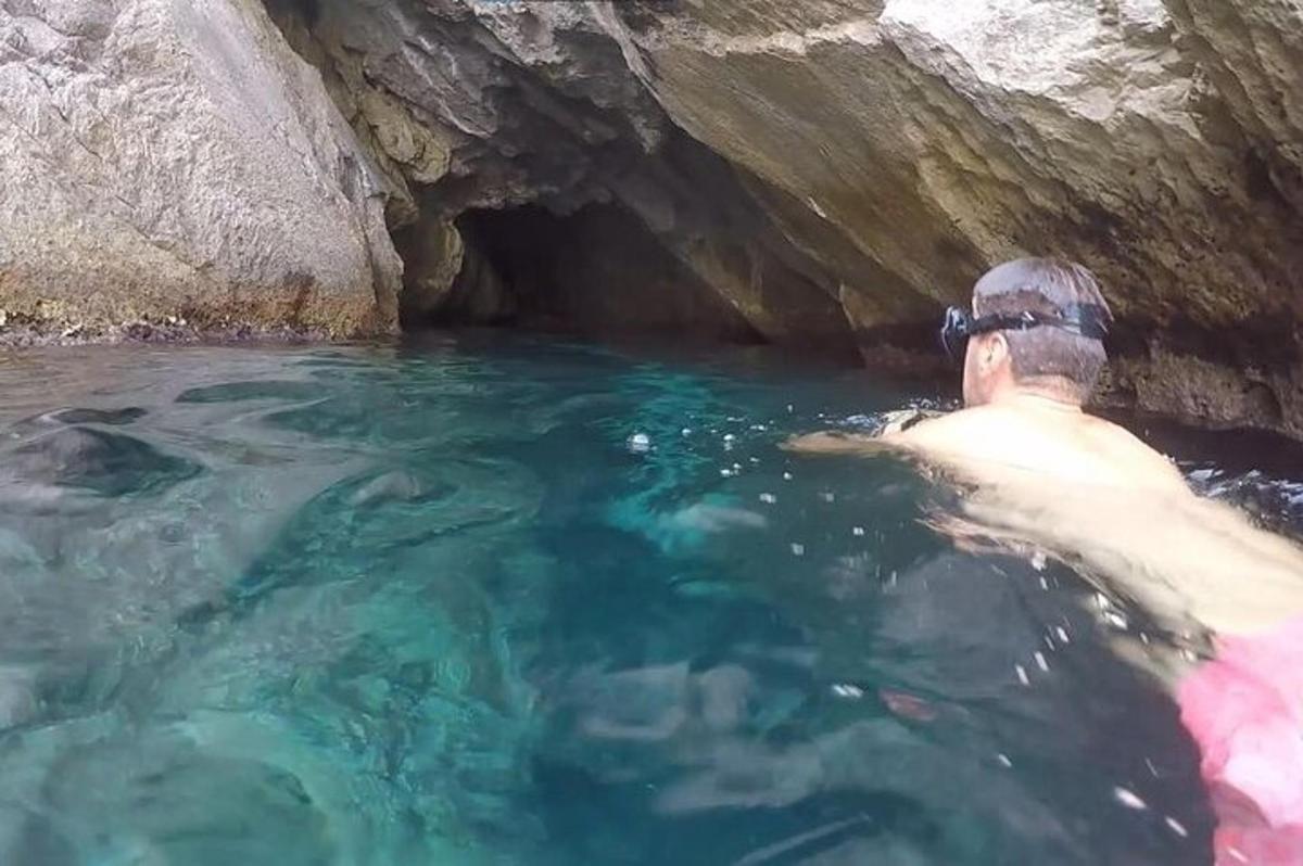 a man in the water in a cave