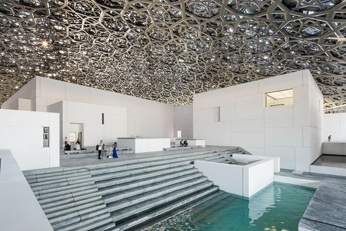 a room with a pool of water and a ceiling