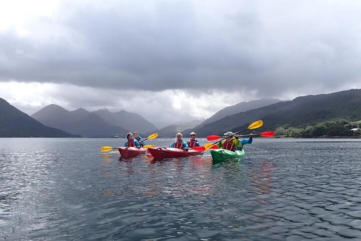 a group of people in kayaks on a lake
