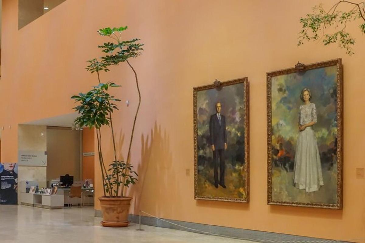 three paintings on a wall in a lobby