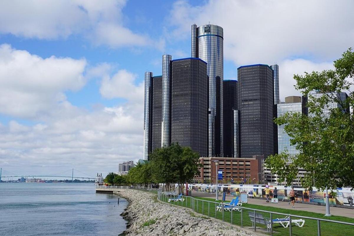 a group of tall buildings next to a body of water