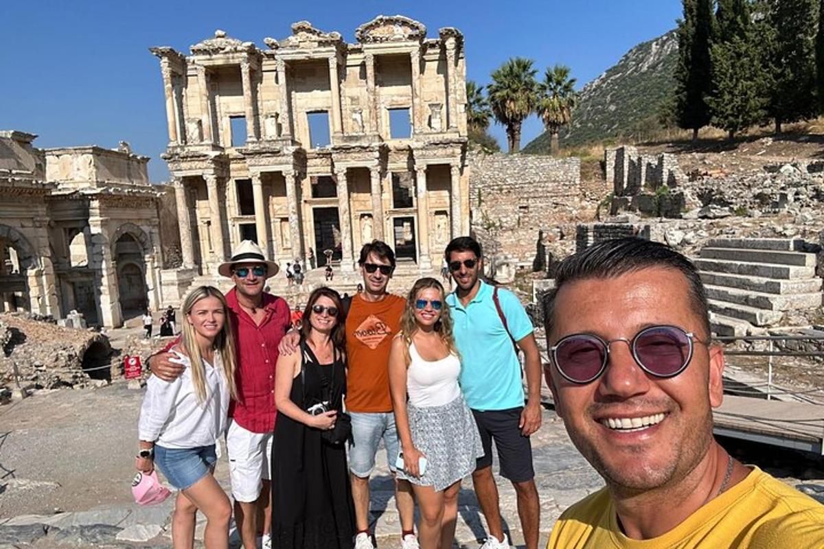 a group of people standing in front of the coliseum