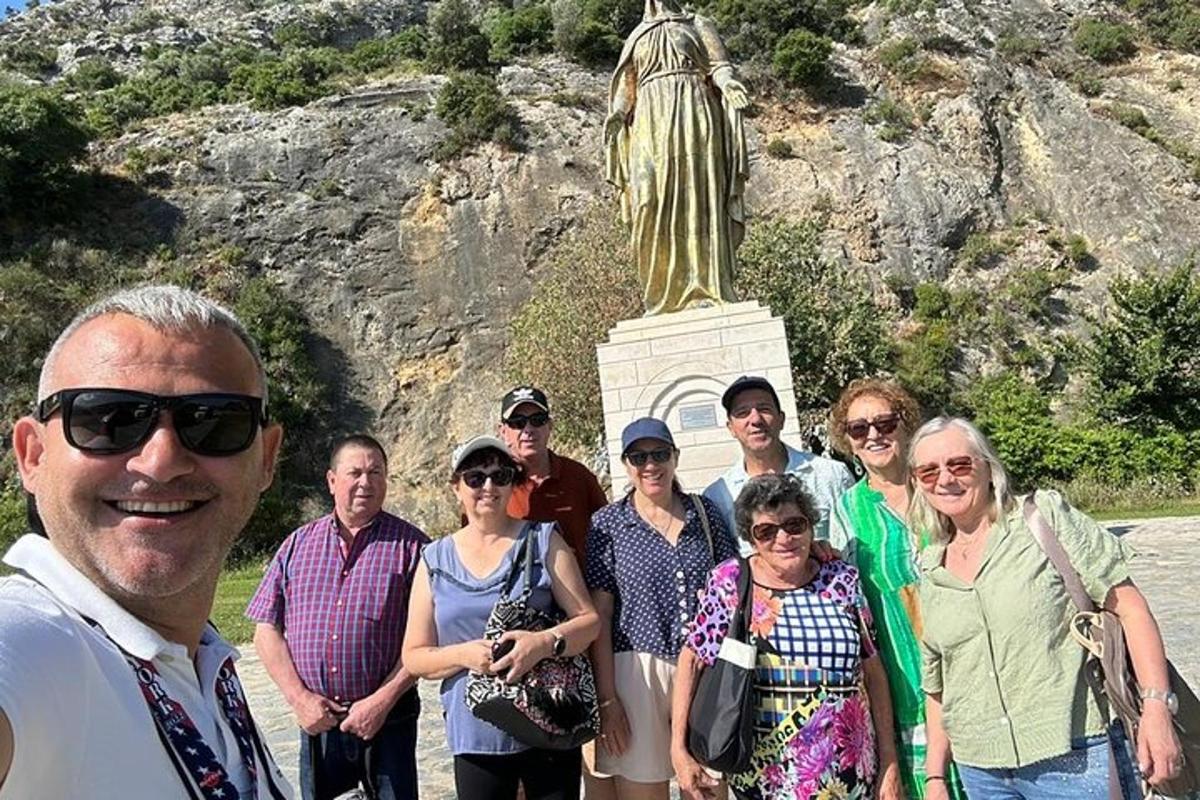 a group of people standing in front of a statue
