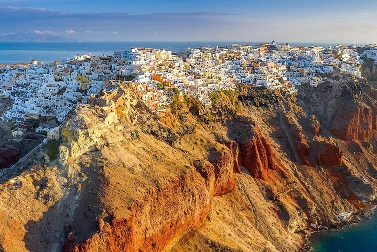 an aerial view of a town on the edge of a mountain