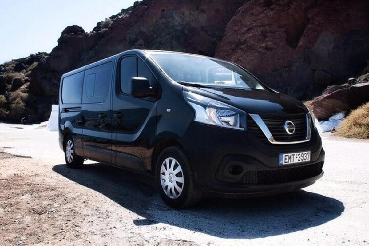 a black van parked on the side of a mountain