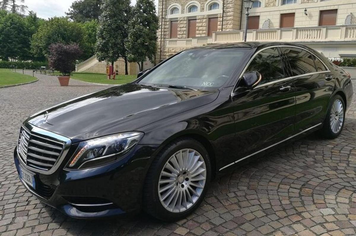 a black car parked in front of a building