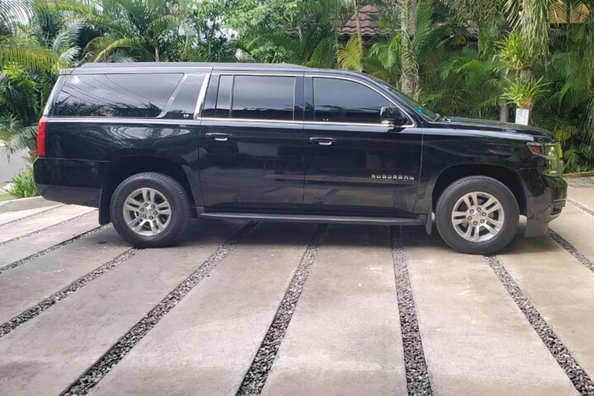 a black suv parked in a parking lot