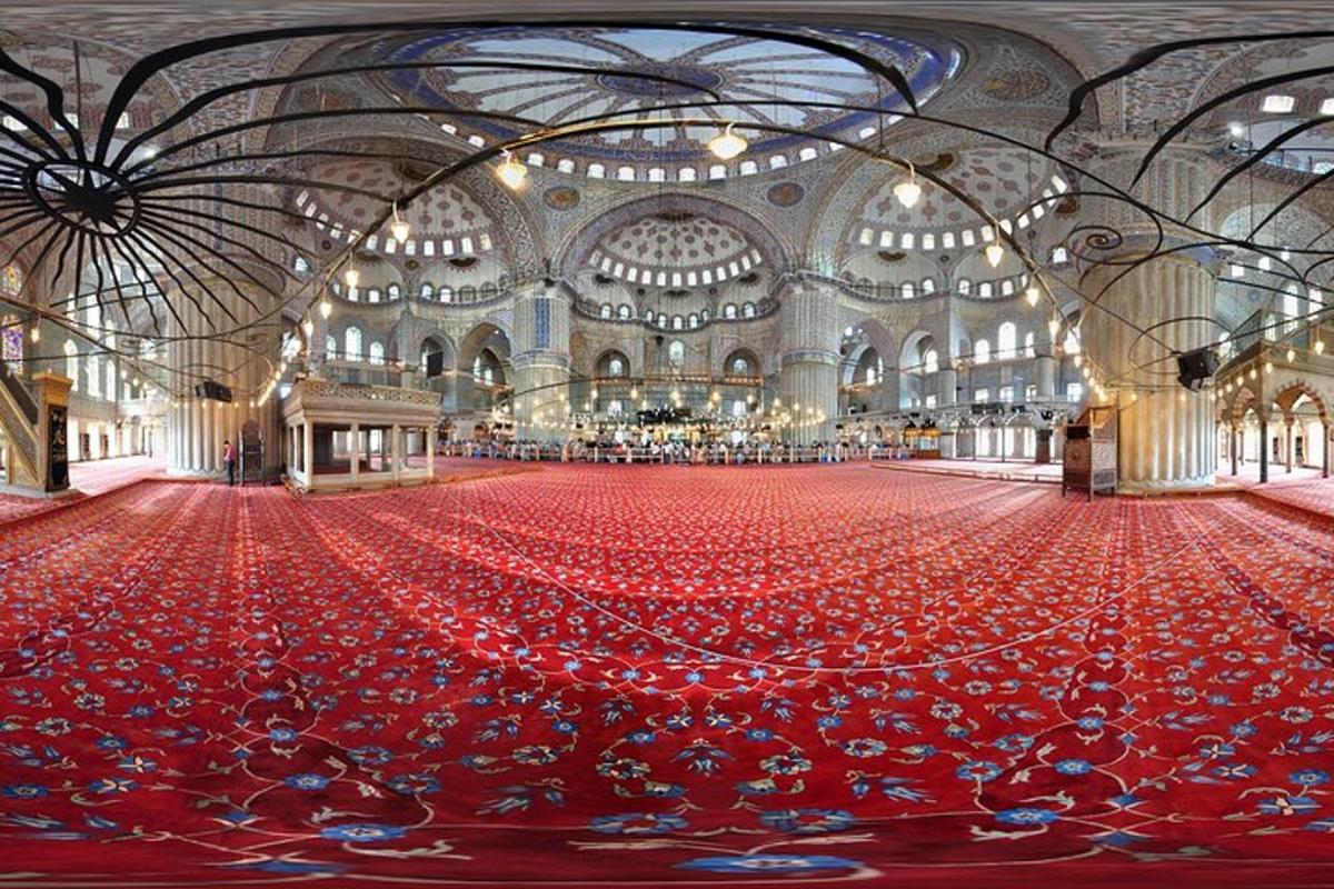 a large room filled with red flooring in a building