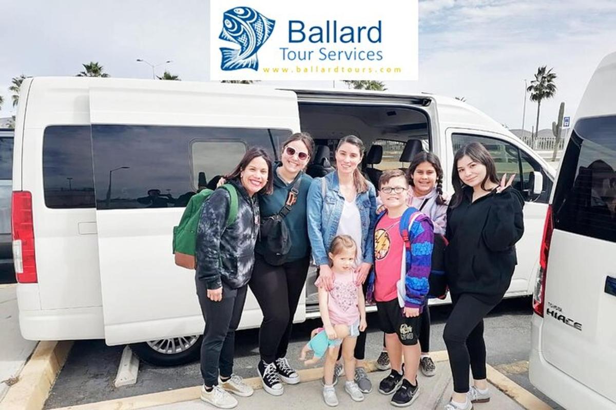 a group of people standing in front of a van
