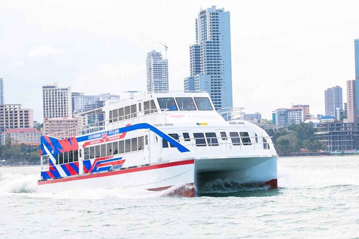 a boat in the water with a city in the background
