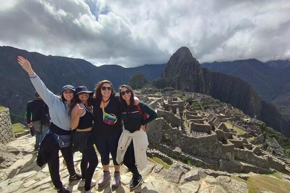 a group of women standing on top of a mountain