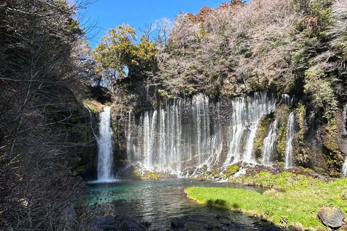 a waterfall in the middle of a pool of water