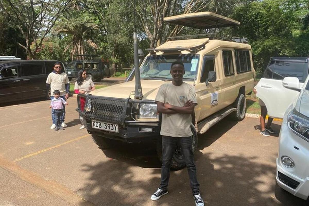 a man standing in a parking lot next to a van