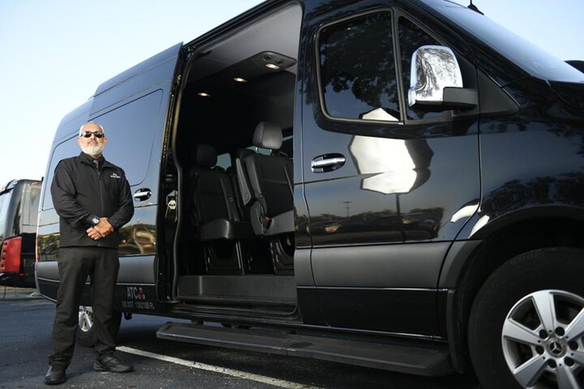 a man standing in front of a black van