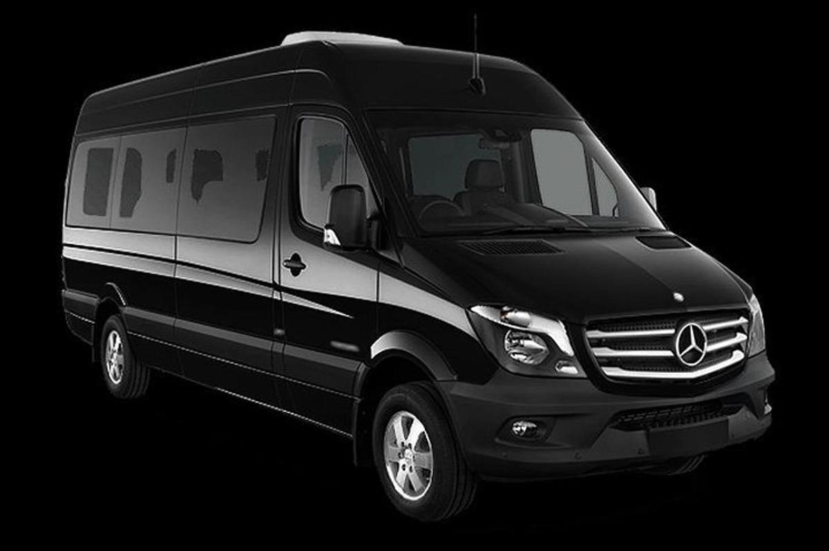 a black and white van in a black background