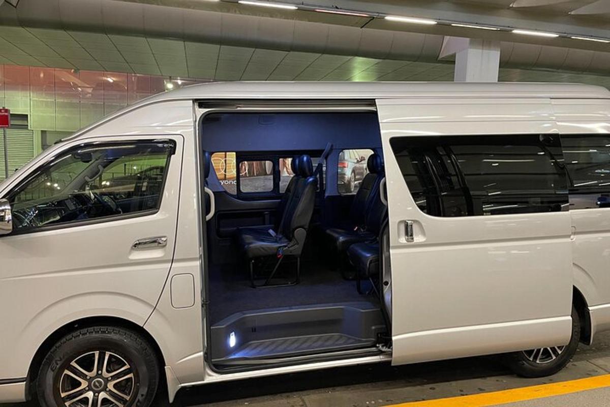 a white van is parked in a parking lot