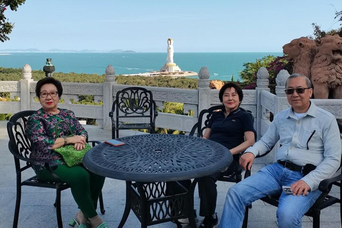 a group of three people sitting around a table