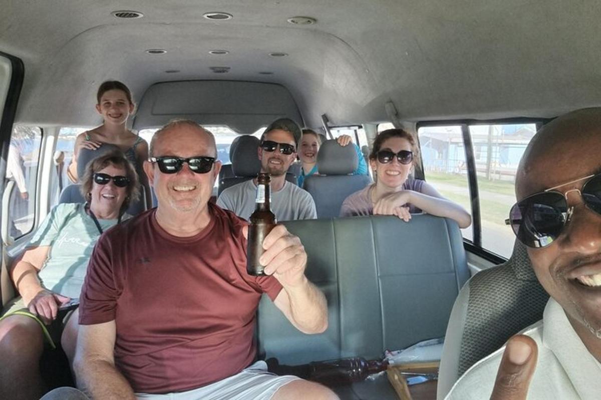 a group of people sitting in the back of a van