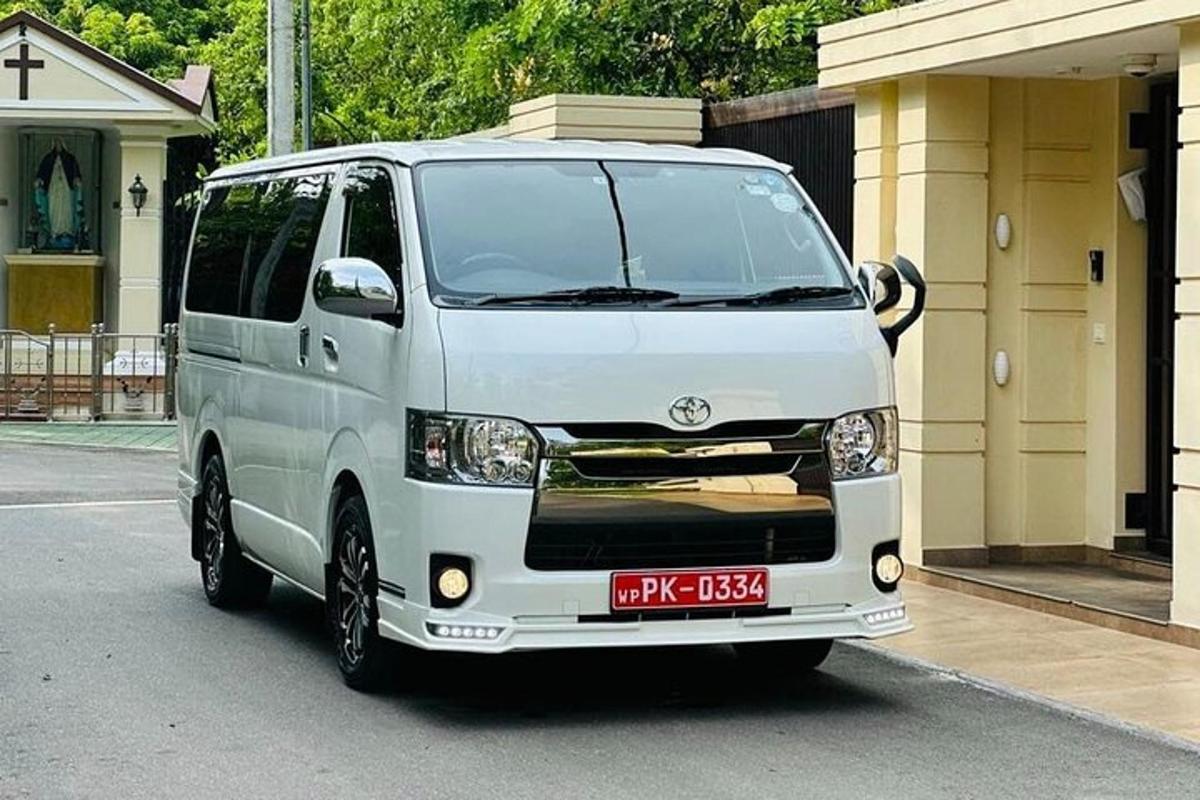 a white van parked in front of a building