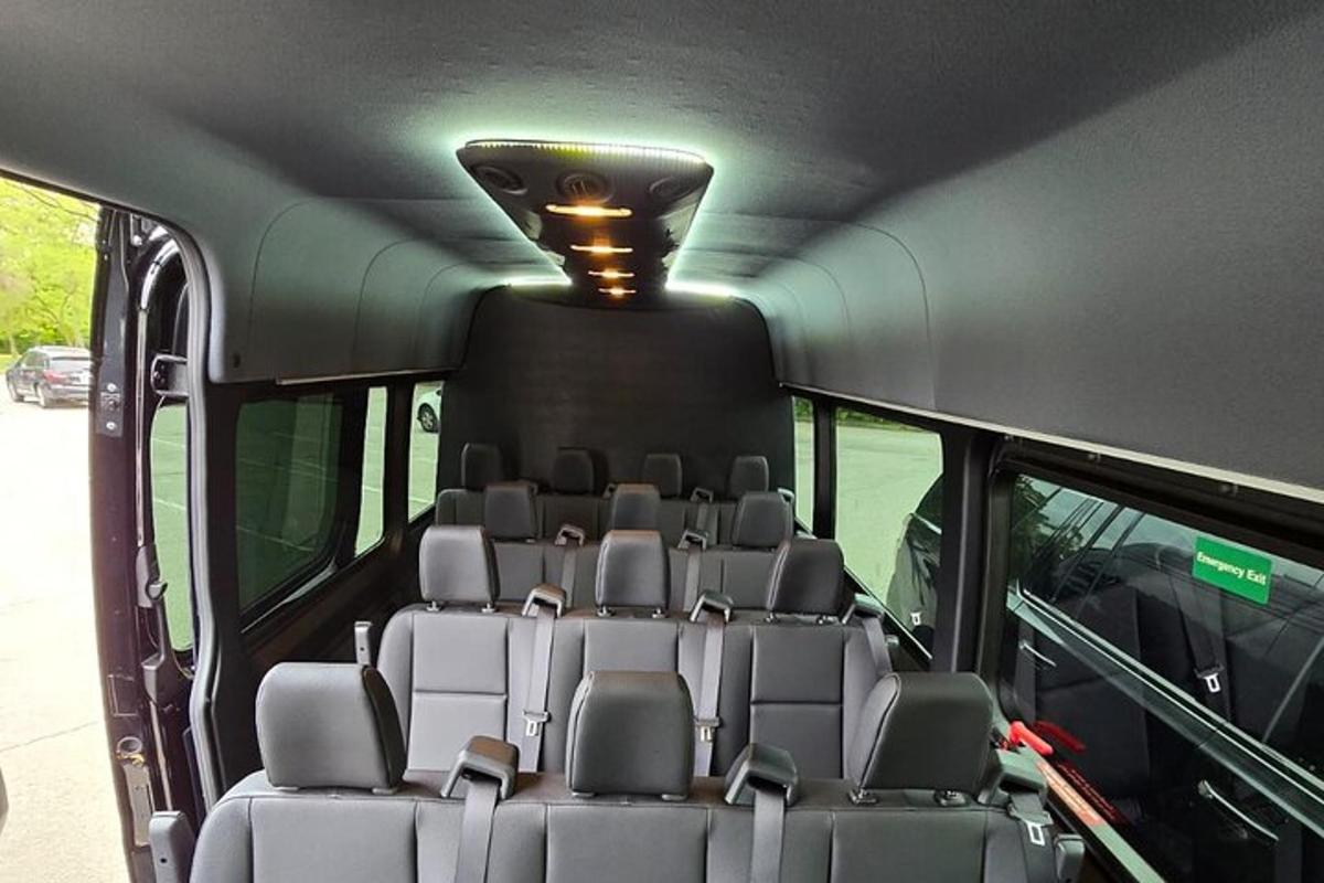 a group of seats in the back of a bus