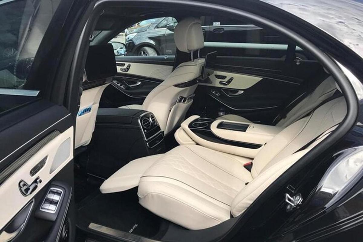 an open trunk of a car with the back seat up